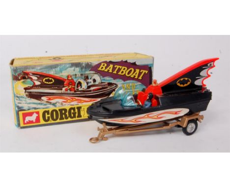 Corgi Toys, 107 Batboat on trailer, black boat with tinplate fin, with both figures, gold trailer, in the original window pic