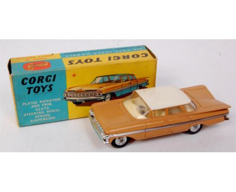 Corgi Toys, 248 Chevrolet Impala, light brown body with white roof, cream interior, spun hubs, in the original blue and yello