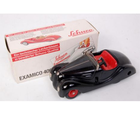 Schuco, 4001 Examico tinplate clockwork car, limited edition production, black with red interior, red plastic hubs, appears i