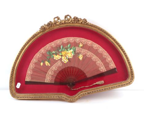 A Large and Decorative Framed Late 19th Century Fan, blousy yellow roses painted on a pale coffee gauze, panels of a lighter 