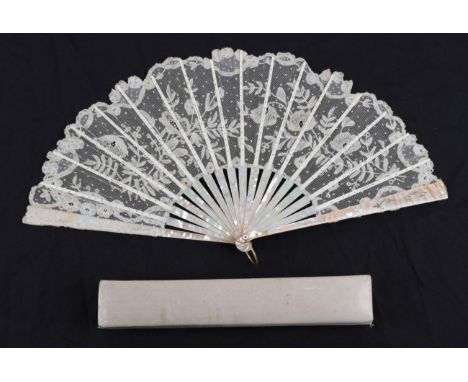 A Circa 1900 Brussels Mixed Lace Fan, the leaf mounted on pink Mother-of-pearl, and lightly gilded with flowers and scrolling