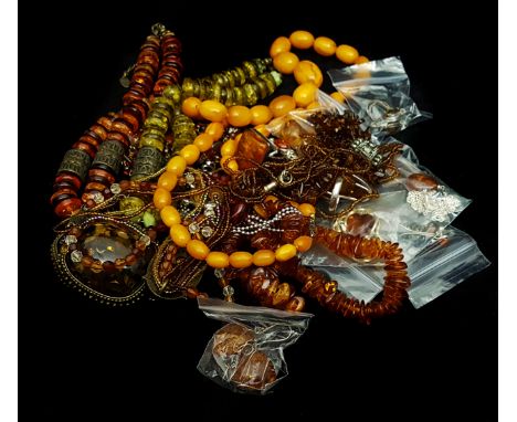 Costume Jewellery - Various items of faux amber jewellery including an antique style bead necklace; a pear shaped ring set in