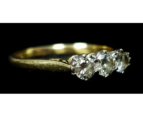 An 18ct yellow gold, three stone diamond ring, ring size Q