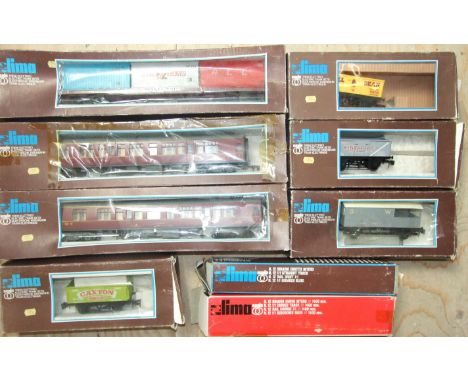 Lima, O gauge, two red LMS corridor coaches, three open wagons, a guard's van and a container wagon, all boxed and two boxes 