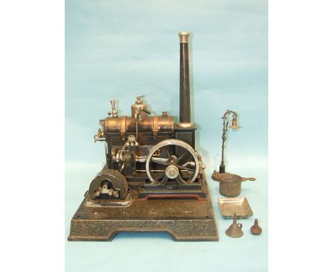 A stationary steam engine by M G & Co, Wurtemburg with horizontal boiler, 4" flywheel, dynamo and additional model street lam