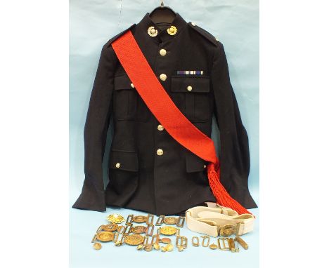 A Royal Marine cap badge and No.1 dress uniform, comprising jacket (size 12), sash and trousers (size M), also a belt and buc