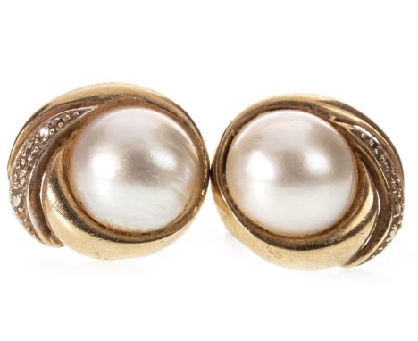 PAIR OF PEARL STUD EARRINGS, each set with a round split pearl 11.5mm diameter, within a diamond set swirl setting, 17.5mm wi