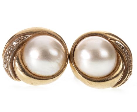 PAIR OF PEARL STUD EARRINGS, each set with a round split pearl 11.5mm diameter, within a diamond set swirl setting, 17.5mm wi