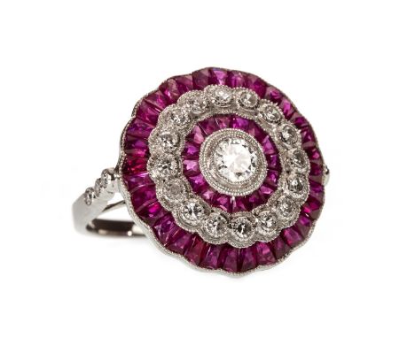 RUBY AND DIAMOND TARGET RING, the central round brilliant cut diamond within alternating calibre cut ruby and round brilliant