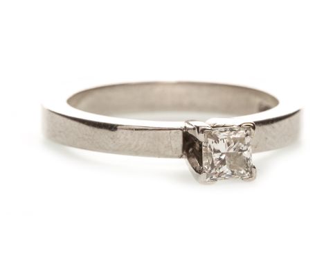 DIAMOND SOLITAIRE RING, the high set princess cut diamond of approximately 0.20 carats, set to a band 2.6mm wide, in eighteen