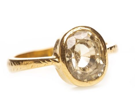 GREEN GEM SET RING, the collet set pale green gem 8mm long, on engraved shoulders, indistinctly marked, size K, 6.7g
