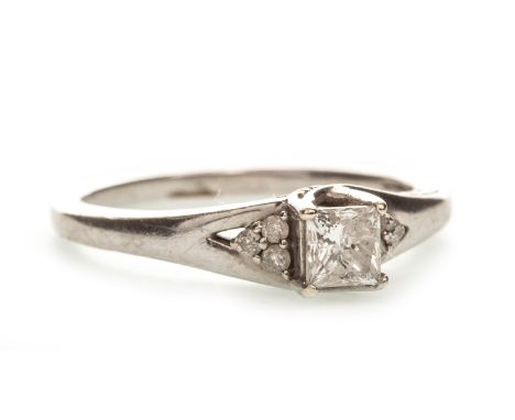 DIAMOND DRESS RING, the central princess cut diamond flanked by three round brilliant cut diamonds on either side, with diamo