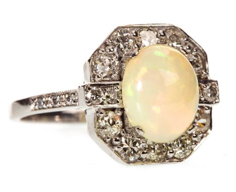 OPAL AND DIAMOND RING, the central cabochon opal 10mm long, within an octagonal bezel set with old cut diamonds, on diamond s