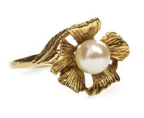 PEARL SET FLORAL MOTIF RING, the central spherical pearl 6mm in diameter, surrounded by engraved petals, marked 18ct, size P,