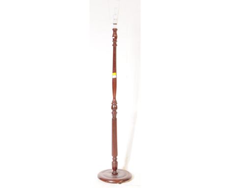 Early 20th century mahogany standard lamp with terraced base having reeded column, complete with the shade. Together with a 1