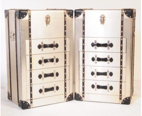 A pair of 20th century silver leather mounted aluminium flight case trunk bedside tables - chests of drawers. Each having a b