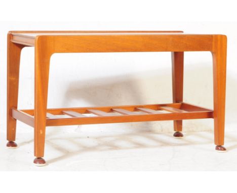 Remploy Furniture - A retro mid 20th century circa. 1960s teak wood coffee table having rail under tier and being raised over