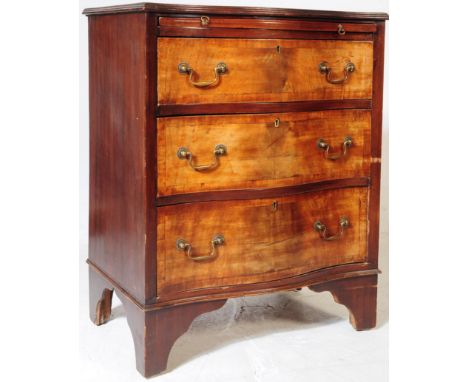 An early 20th century Edwardian circa 1900s walnut bachelors chest of drawers. The chest having chamfered top with serpentine