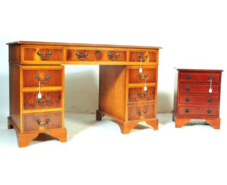 A 20th century George III revival mahogany twin pedestal writing desk having green leather skiver with tooled gilt to edge ov