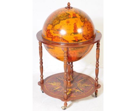 A 20th Century vintage terrestrial mahogany veneer globe drinks cabinet with hinged lid to reveal decanter cocktail cabinet, 