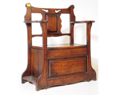 A 20th century arts and crafts style small proportioned oak hall chair / settle bench. Having a shaped pierced back and arms 