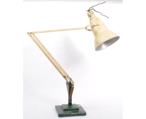 A vintage mid 20th century Anglepoise industrial desk table lamp light. Having a cream conical shade, with hinged spring load