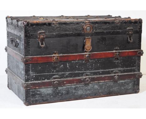 A 19th century Victorian wooden and metal bound steamer trunk chest. The chest having wooden bandings with with metal protect