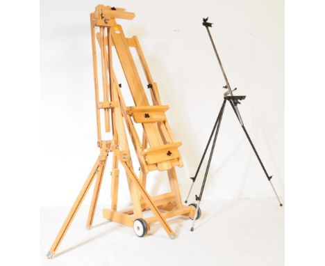 A collection of contemporary Artist's easels. Comprising of a large pine construction easel, with a smaller ebonised metal tu