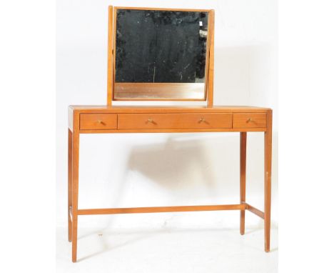 Heals of London - Loughborough Furniture - A&nbsp; vintage 20th century teak wood dressing table. Having rectangular mirror b