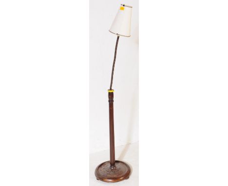 A vintage retro mid 20th century circa. 1970's standard floor standing gooseneck lamp. The lamp having tapering wooden shaft 
