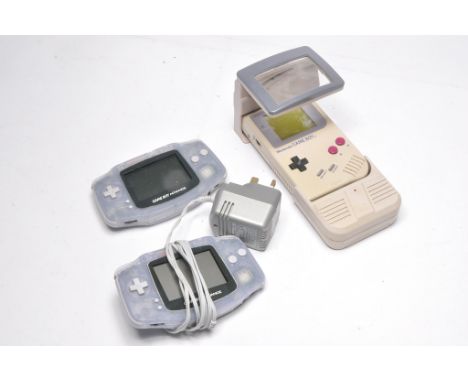 Nintendo Gameboy with Light Magic attachment plus duo of Gameboy Advance systems, as shown.