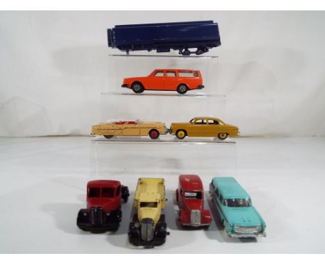 Dinky Toys - eight unboxed and playworn model motor vehicles by Dinky Toys to include #132 Packard, Ford Sedan, a lorry with 