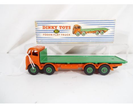 Dinky Toys - A Dinky Toys # 902 Foden Flat Truck, orange cab and chassis with green flatbed and hubs. In original blue and wh