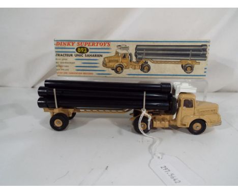 Dinky Supertoys - A French Dinky Supertoys # 893 Tracteur Unic Saharien (Unic Sahara Tractor), fawn cab, trailer and hubs and