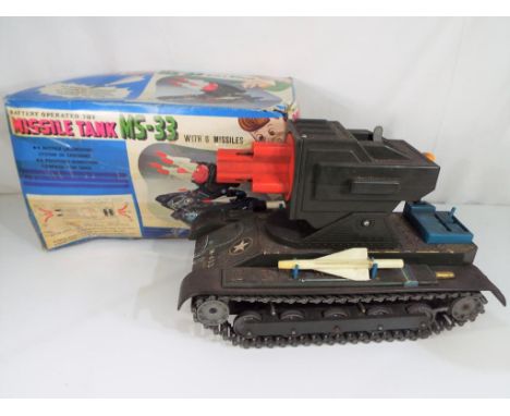 A Modern Toys tinplate battery operated MS-33 missile tank missing four missiles, included is part of the original box (heavi