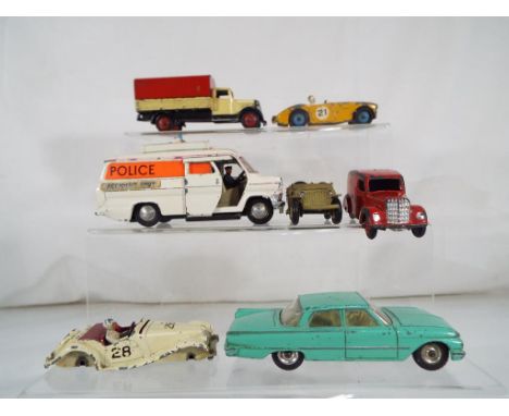 Dinky Toys - 7 unboxed and playworn diecast model motor vehicles by Dinky Toys to include Ford Transit Van, # 108 M.G Midget 