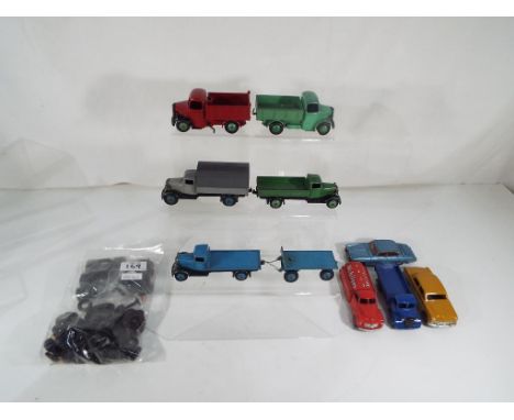 Dinky Toys - nine unboxed and playworn diecast model motor vehicles by Dinky Toys to include #142 Jaguar Mk X, #441 Studebake