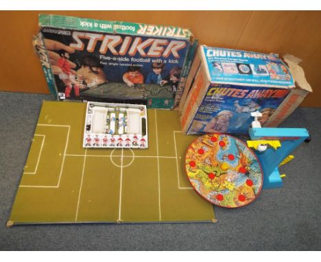 A Striker 5-aside football game with a kick table-top by Parker in original box and a Chutes  Away tabletop game by Marx Toys