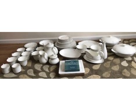 A large quantity of Royal Doulton dinner and tea ware to include 8 teacups and saucers, 1 teapot, 1 sugar bowl with lid, 1 mi