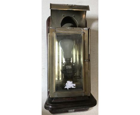 Victorian brass oil lamp converted to electric and mounted on wooden bracket 