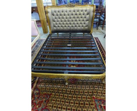 A gilt framed bedstead with silk button back upholstery - with irons and slats - 120cm x 160cm