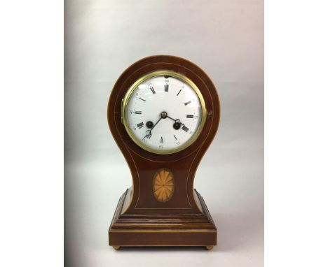 EDWARDIAN BALLOON SHAPED CLOCK, two train eight day movement, the white enamel dial with Roman numerals, contained in a mahog
