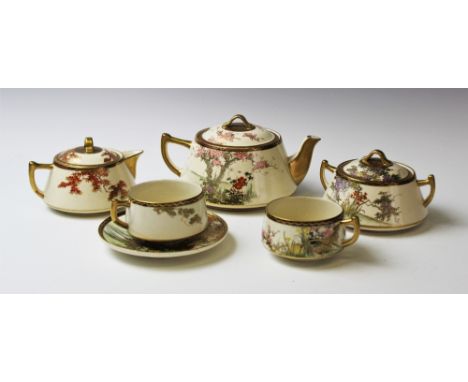 A Japanese Satsuma tea service, 20th century, comprising; six tea cups and saucers, a teapot, milk jug and sucrier, all decor
