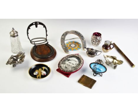 A selection of objects of virtue, to include, a silver photo frame, a silver mounted cut glass caster, an ornamental horsesho