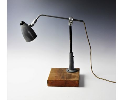 A Singer LF5 sewing machinist's work lamp, mid 20th century, the shade of bullet form with integral rotating switch cap to th