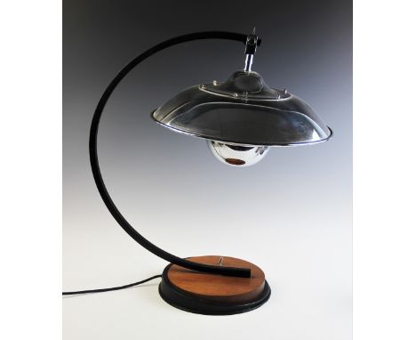 An Art Deco style table lamp, late 20th century, the bowl shaped chromed shade supported on a 'C' shaped box section bracket,