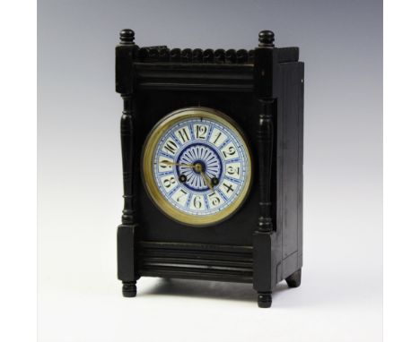 A late 19th century Japy Freres aesthetic movement mantel clock, with a scalloped gallery above the 11cm diameter blue and wh