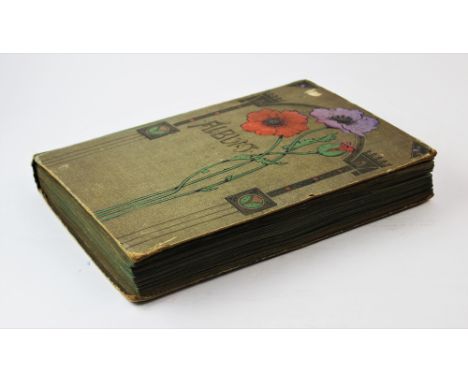 An Edwardian album, the cover decorated with floral and architectural motifs, containing a collection of approximately 200 ea
