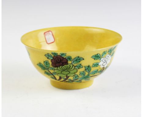 A Chinese porcelain yellow ground sgraffito bowl, Kangxi six character mark (20th century), of flared circular form and exter