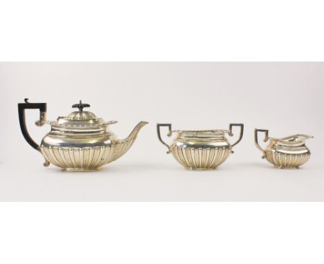MILITARY INTEREST: An Edwardian three-piece silver tea service by Charles Westwood & Sons, Birmingham 1901, each piece of rou